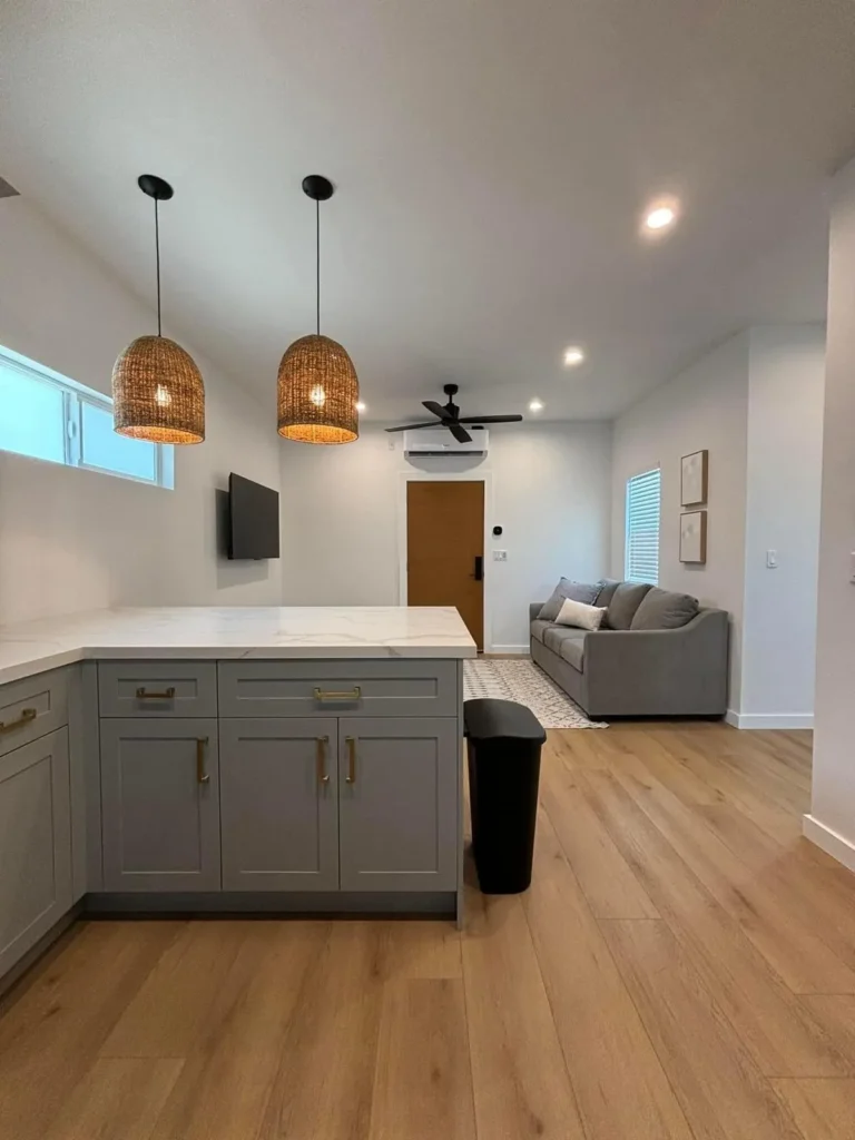 Vaulted bonus room with pendant lighting and a built-in bar area, remodeled by DC Home Renovations in Los Angeles.