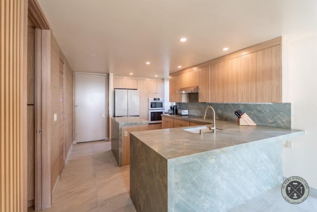 Luxury kitchen remodel in Newport Beach, CA, featuring custom shaker cabinets, quartz countertops, modern finishes, and professional kitchen renovation by DC Home Renovations Inc.